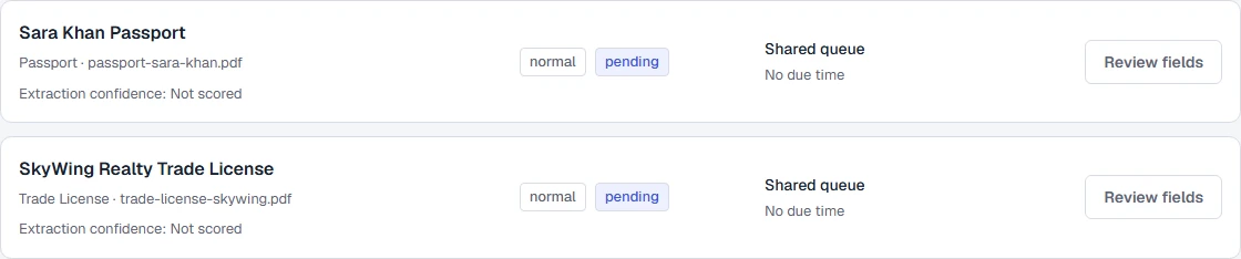 Two synthetic documents waiting for review, with source filenames, pending states and review actions